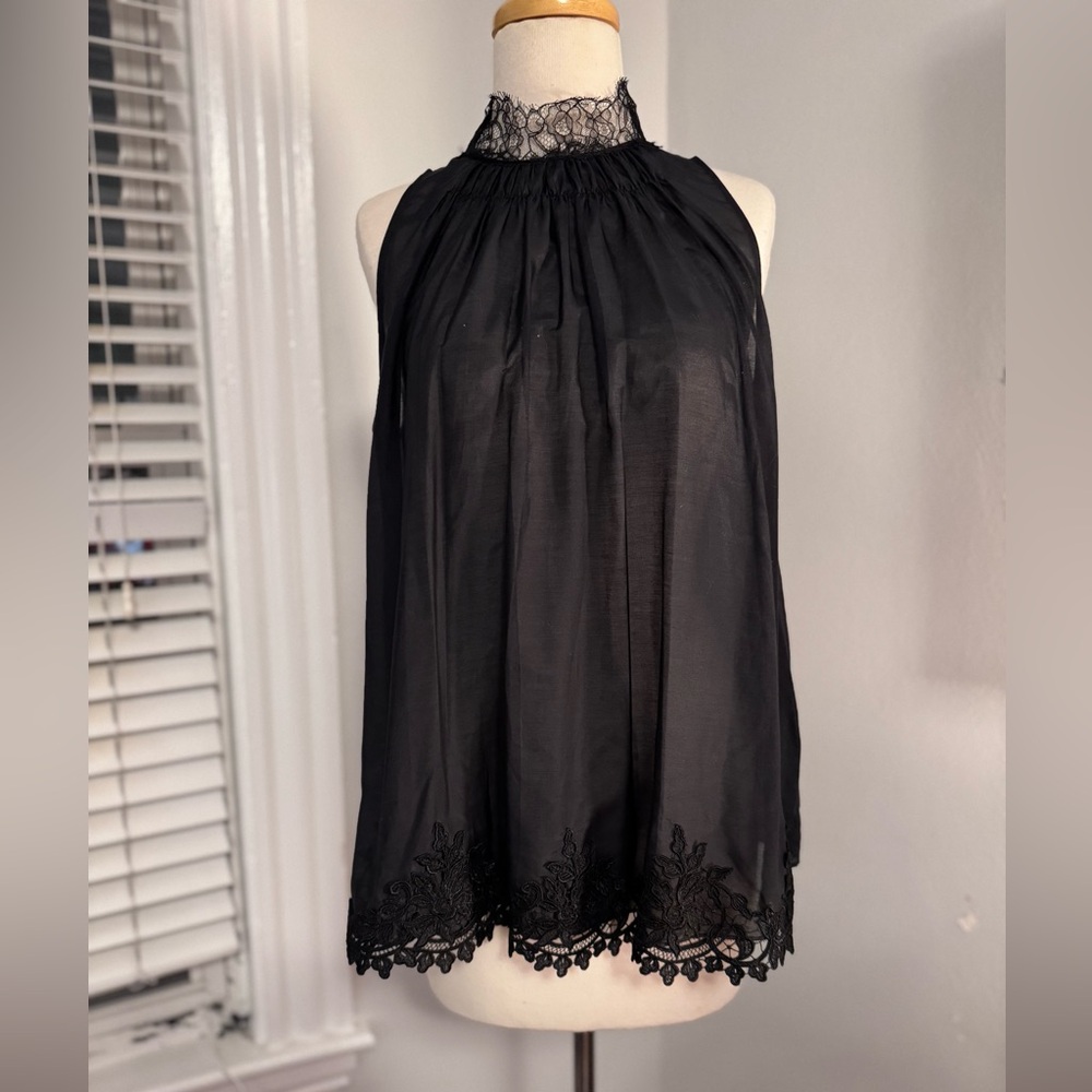 Elegant Black Sleeveless Top with lace neck and embroidered Lace Hem